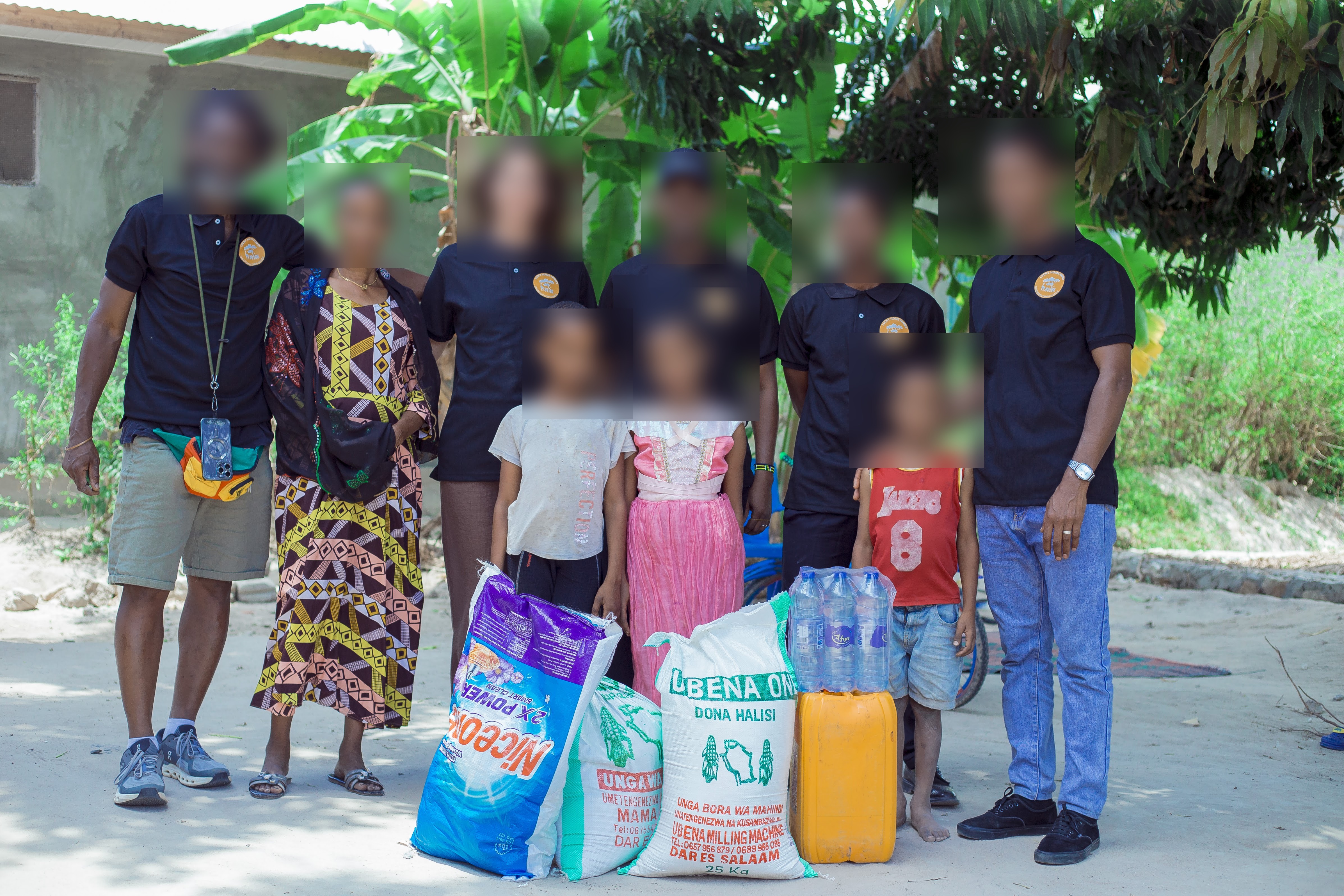 Programme photo from the live site — children's faces blurred for safeguarding.