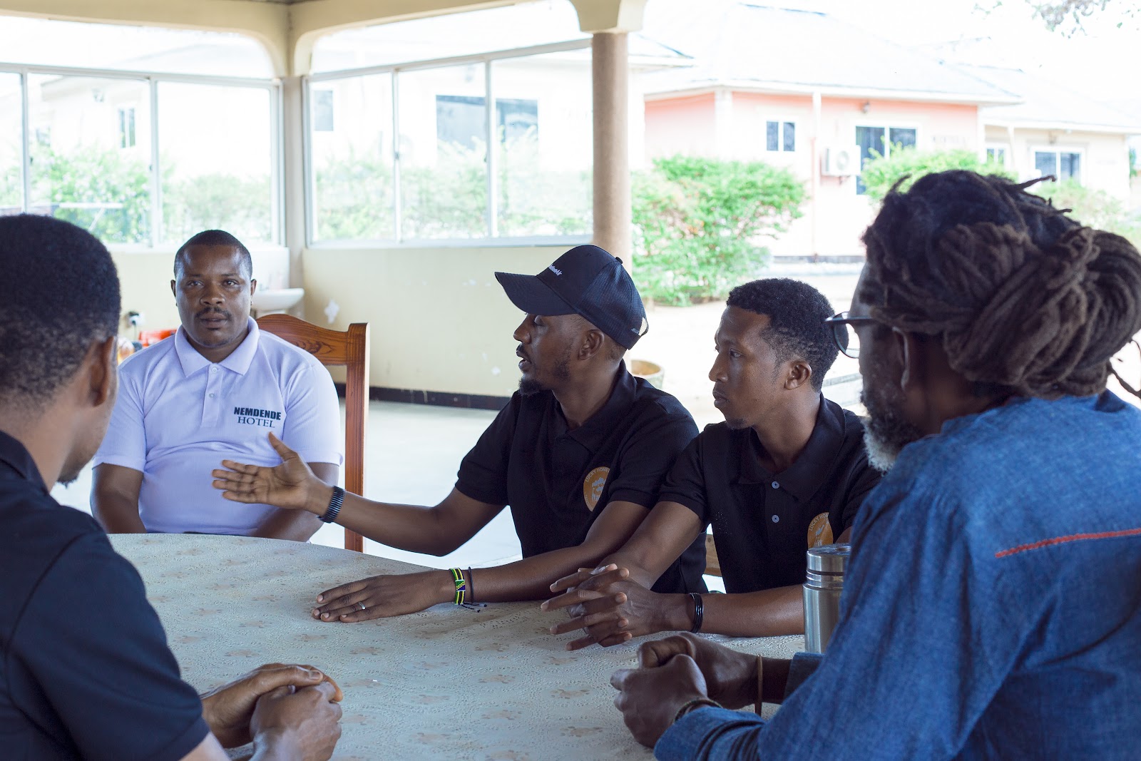 Team meeting at Lucky Home Family — adults around a table, no children in frame.
