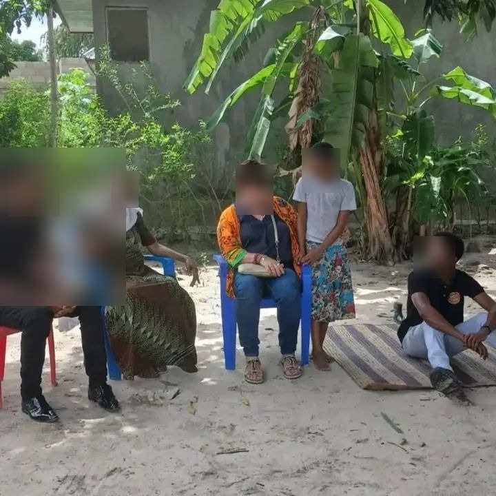 Gallery moment with carers and children — faces blurred for safeguarding.