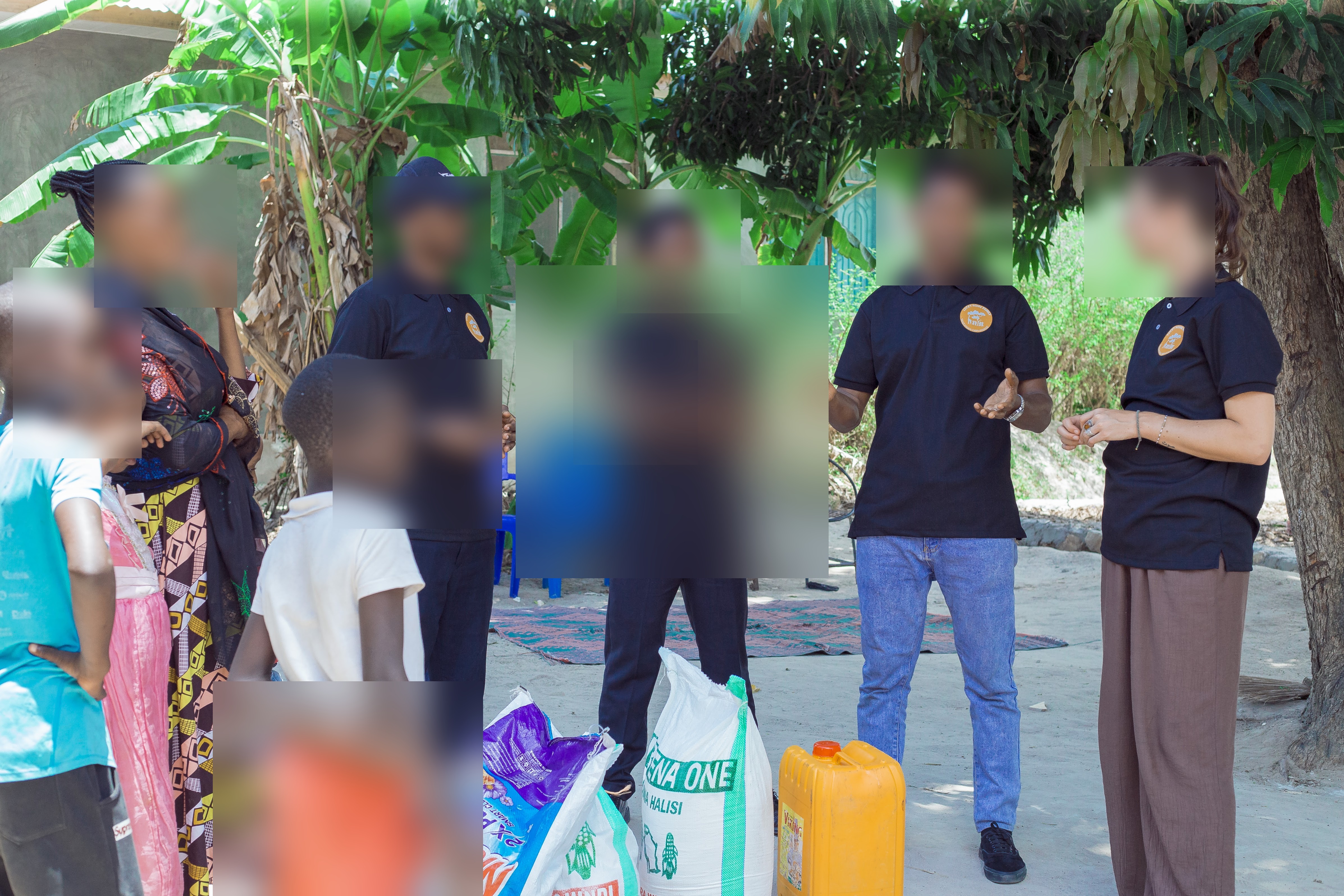 Outdoor programme photo — children's faces blurred for safeguarding.